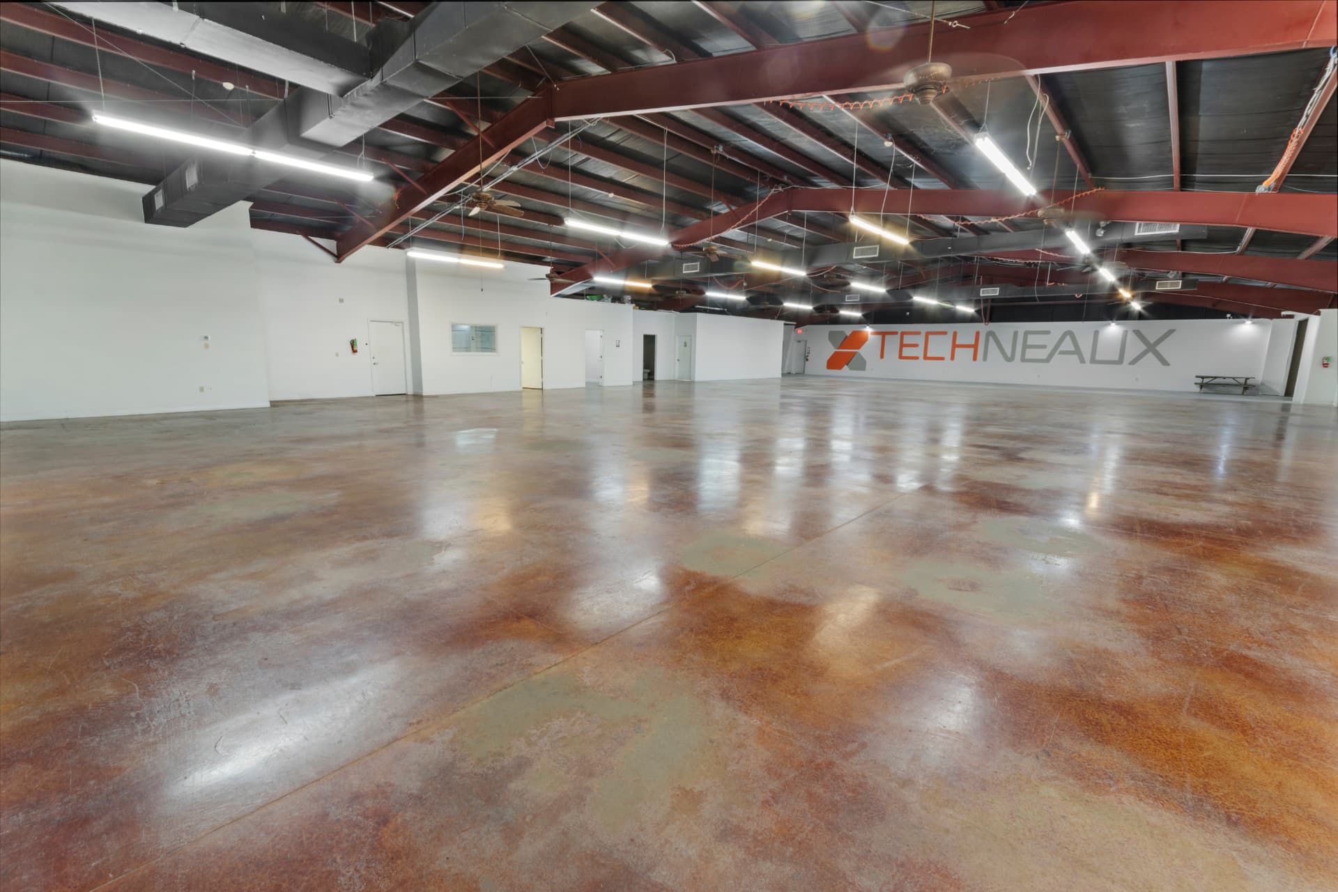 Open climate-controlled interior with stained concrete flooring
