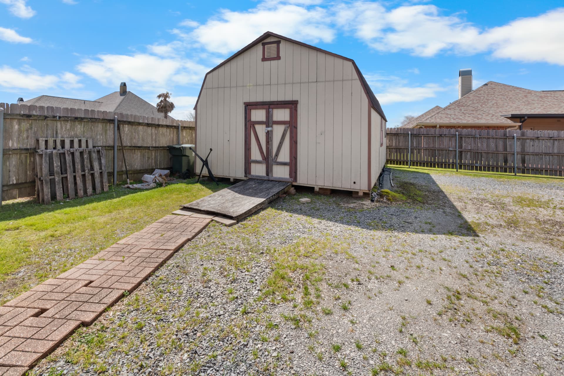 On-site storage shed in the fenced rear yard